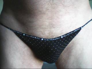 Black poka-dot panties with a nice package inside.