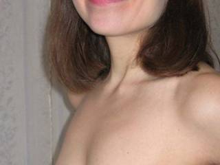 Wife smiling with her saggy tits.
