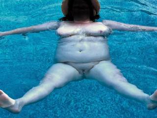 Naked in the pool on holiday.