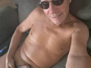 Naked in the chair.