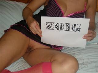 showing a little pussy with a zoig sign