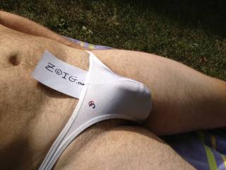 Lounging outside in white Joe Snyder thong