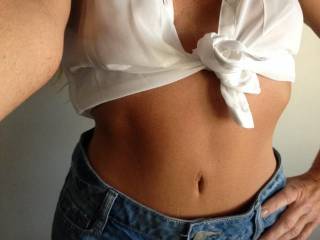 dam I love this pic, call me old school, but a white shirt and denim with a tummy showing....outstanding