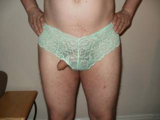 poking out of pastel green lace panties