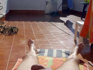 Naked sunbathing