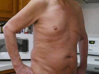 Hot and Naked in the kitchen.