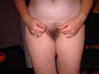 sue ellen standing and showing her hairy pussy