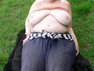 Laying on her coat, drying her sperm-stained trousers. Big tits looking lovely ;)