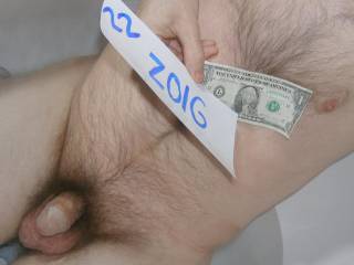 My small dick is taking a bath & a dollar is present, besides my chest. Camera used, C7070.
