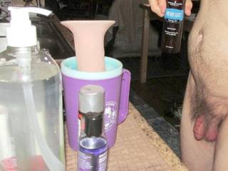 A side standing frontal near my kitchen counter... I am holding a certain massage product that I had learned a certain aromatherapy meeting/class, that some couples were using this product as a lube...September 2025... A Canon 160 camera was used.