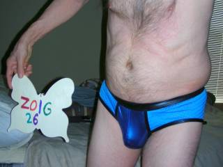 A frontal of my blue undie as I stand near my bed with the blinds closed behind me. S10 camera was used.