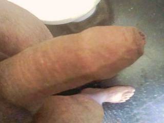My long foreskin also completely covers my glans even when my cock is erect