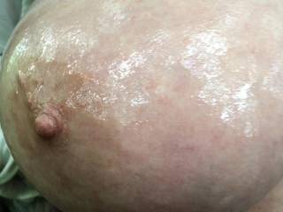 Hard nipple so she must like getting her big tits gently oiled by the guest ;)