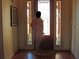 Posing hubby nude by the front door.  I was hoping for a knock at the door!