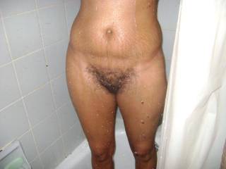 having a shower and showing my hairy pussy