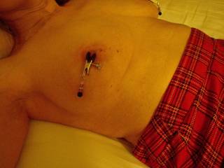 Showing off her new nipple clamps