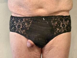 Cock peeking out of my wife’s lacy black underwear.
