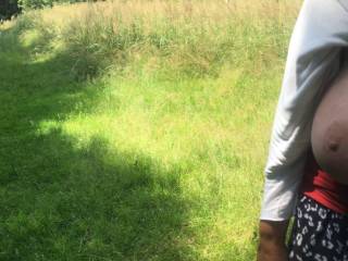 Tits out, waiting for the guest to walk along the grassy woodland path, to then turn when he arrives