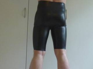 Hubbys latex outfit more from behind. Not bad for 46 yo? ;-)