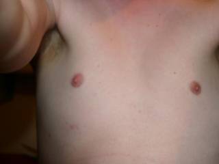 22 years old and still a completley hairless chest! Sorry about the angle, my camera doesn\'t have a timer!