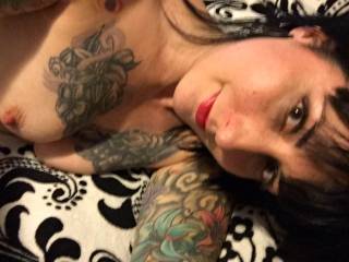 Cute tattooed lady showing off her tits and beautiful face love sucking on those nipples