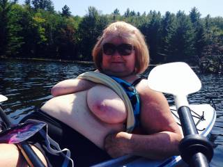 Flashing my big tits on a lake in my boat. Do you want to go boating on the lake?