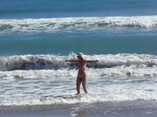 nude women make wet on ocean beach