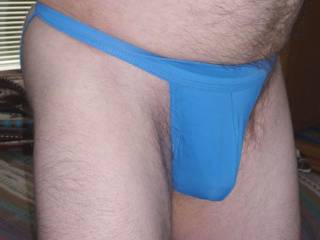 A side frontal view of my bottomless undie in the daytime as I stand near my bed in April of 2023. Camera used, Z50.