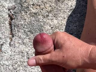 Spent the afternoon at the like skinnydipping and getting some sun. Got horny and started stroking before shooting out ropes of cum all over the rocks.