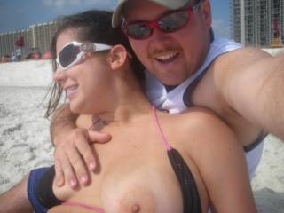 showing her titty and pretty pink nipple on the beach