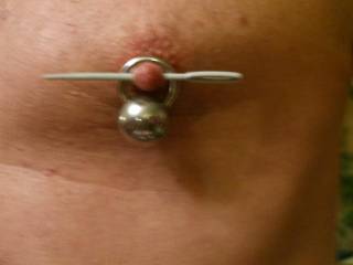 Enlargin tit piercing hole