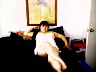 lounging on the bed in my white teddy