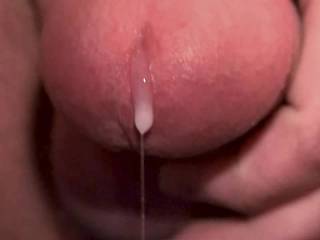 Edged and oozed thick cum strings. Extreme closeup.