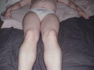 relaxing on the bed in panties