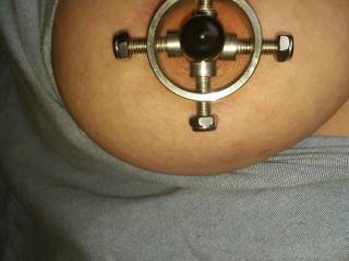 Her new nipple clamps.
