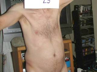 A partial body frontal as a selfie as I stand with Netflix paused on the TV. SX160 camera was used.