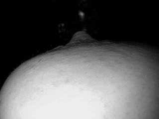 A black & white close up of my wife\'s breast and nipple.