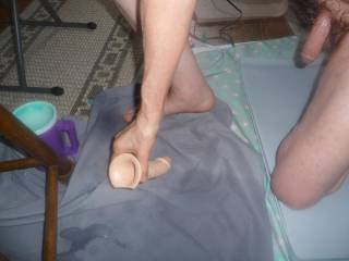 One knee on my floor with a hard dick as I attempt to use my toy to recycle the lube puddle near my bar stool...early May 2025... Z50 camera was used.