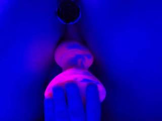 Toying herself with with new dildo under the black light