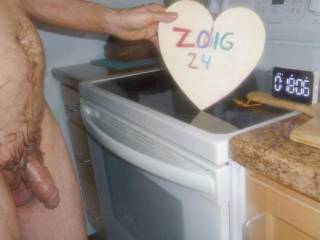 A side scene as I stand near my stove with a cooking timer waiting to start the countdown for cooking a pizza. Z50 camera was used.