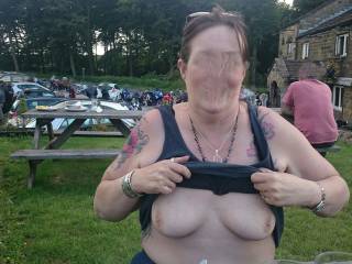 Re Edited to remove the faces of the people in the background.
Mrs flashing outside our local on bike night.