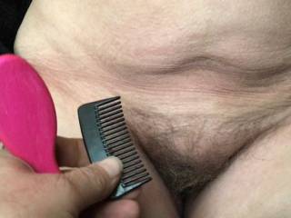 \'Yes!\' she laughed, still amused by the photographer running a brush and comb through her cunt hairs - with him asking is it alright if she then takes her coat off and spreads for him - \'of course I will\'