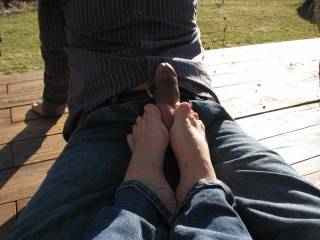 perfect footjob on the patio...