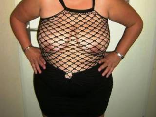 You look great.  So sexy in this fishnet and  your black skirt.
I'll be happy to lift your skirt up or all the way down off of you. I can promise you my hands will have you so warm, wet.