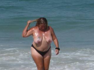 deb at the beach looking for some one to help her from getting a sun burn