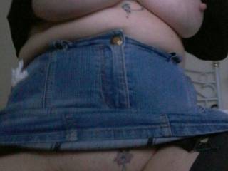 exposed in a casual way... Sally wears a denim skirt with such style! She cant help but show off her great breasts too!