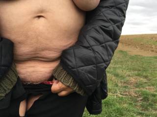 Tits out, standing downhill and flashing her cunt