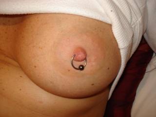 mmm that really is a lovely tit and looks so sexy with that ring thru the nipple very suckable mmmm