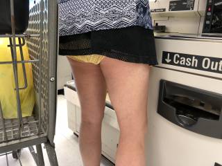 Showing everyone in the market her see through yellow panties.
