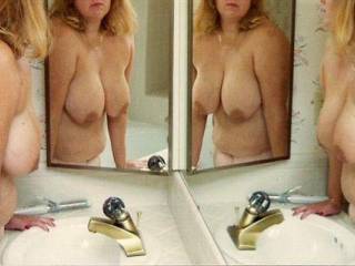 Took advantage of the mirrors in a resort bathroom.  4 X the Tits!!